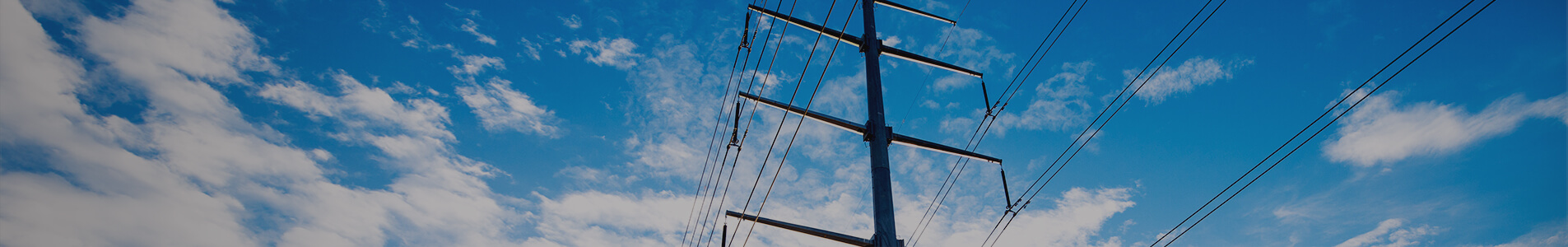 utility transmission pole against sky